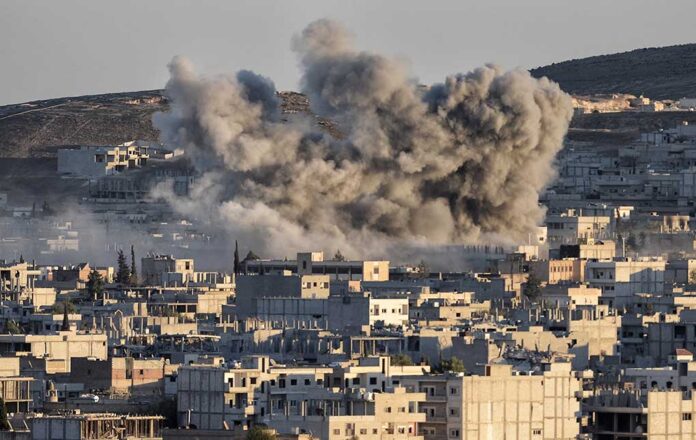 Smoke rising from buildings in a city.