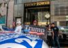 People holding Trump 2024 banner outside Trump Tower.