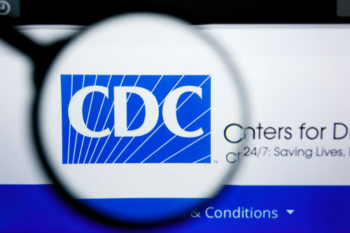 shutterstock_1450445633 (2).jpg Magnifying glass over CDC logo on a website.