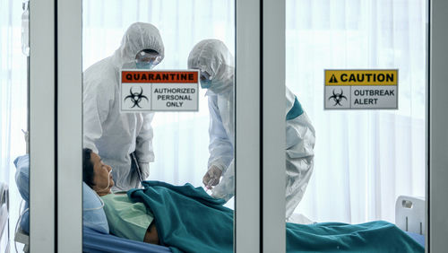 shutterstock_1647350797 Patients and healthcare workers inside a quarantine zone.