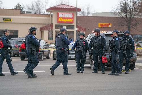 shutterstock_1941371251 Police officers gathered outside King Soopers grocery store.