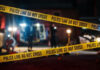 Federal Raid Turns Deadly — FBI Steps In Yellow police tape at a nighttime crime scene.