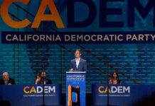 Speaker at podium during California Democratic Party event