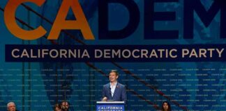 Speaker at podium during California Democratic Party event