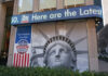 Facade with Statue of Liberty graphic and election-themed signage