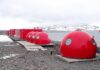 Taxpayers Fund Ghost Internet Red dome shelters at a polar research station by the sea
