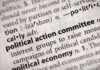 Close-up of a dictionary entry for political action committee